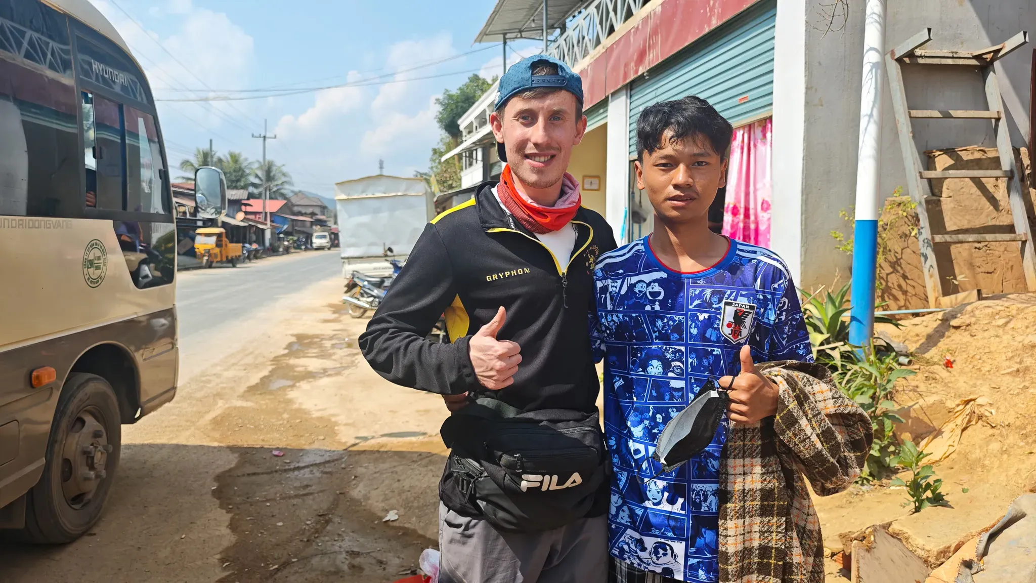 A traveller and a villager giving a thumbs up